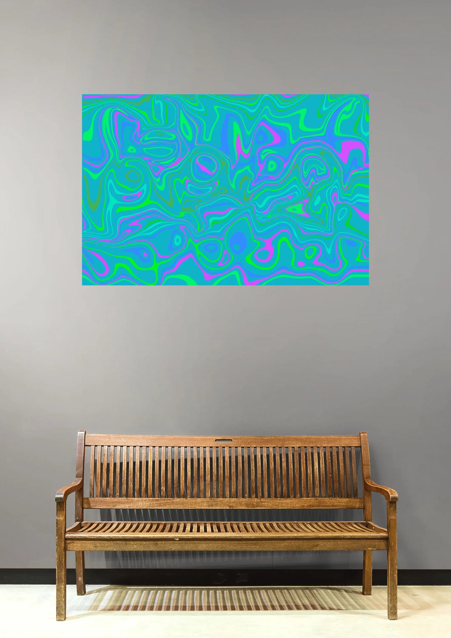 Abstract colorful painting on a gray wall above a wooden bench.