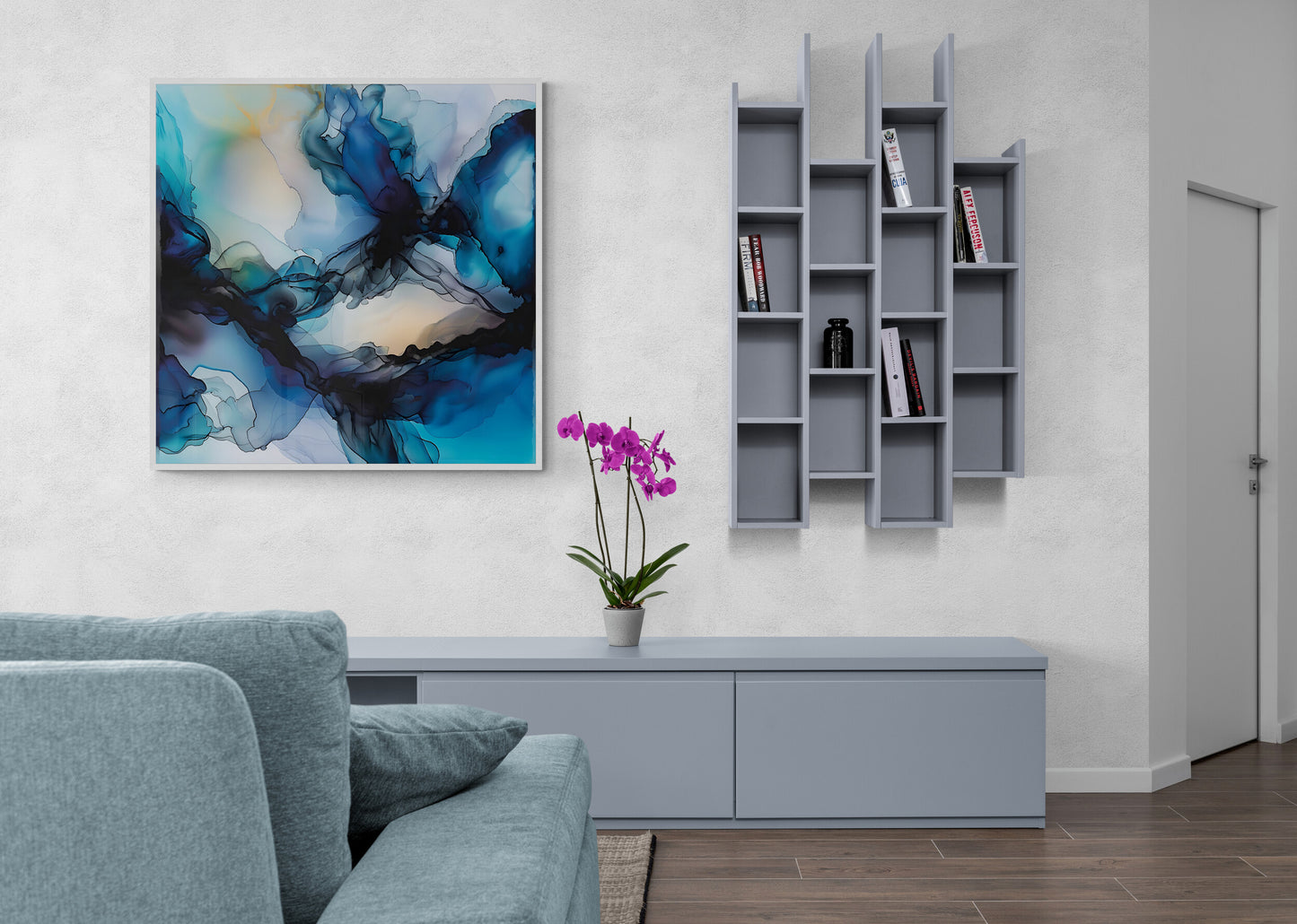 Modern living room with abstract painting, bookshelf, and gray sofa.