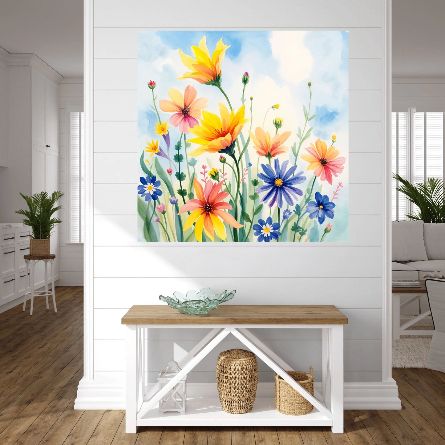 Floral painting on a wall above a wooden console table in a living room.