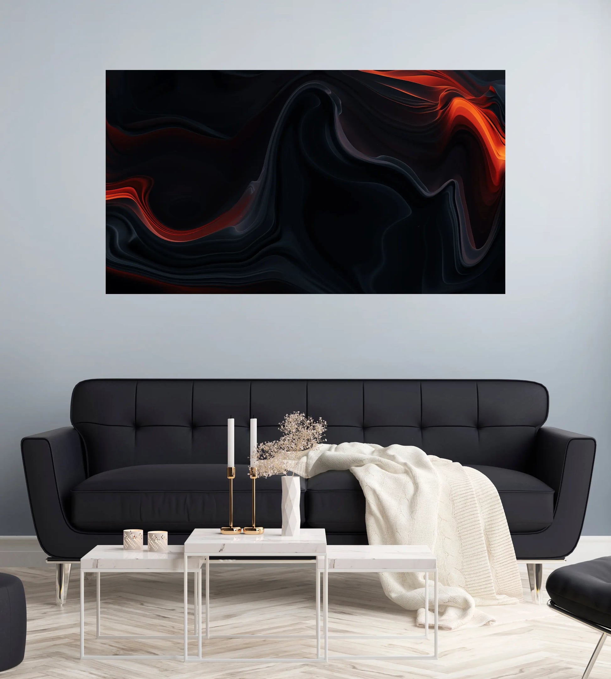 Modern living room with a black sofa, white coffee table, and abstract wall art.