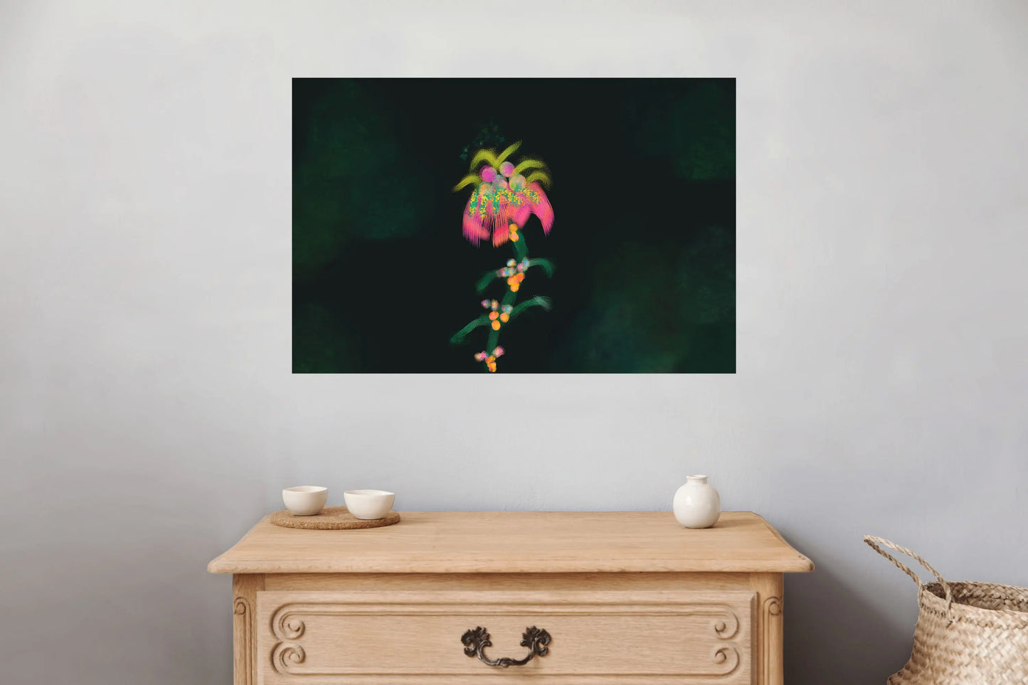Framed artwork of a pink flower on a gray wall above a wooden cabinet.