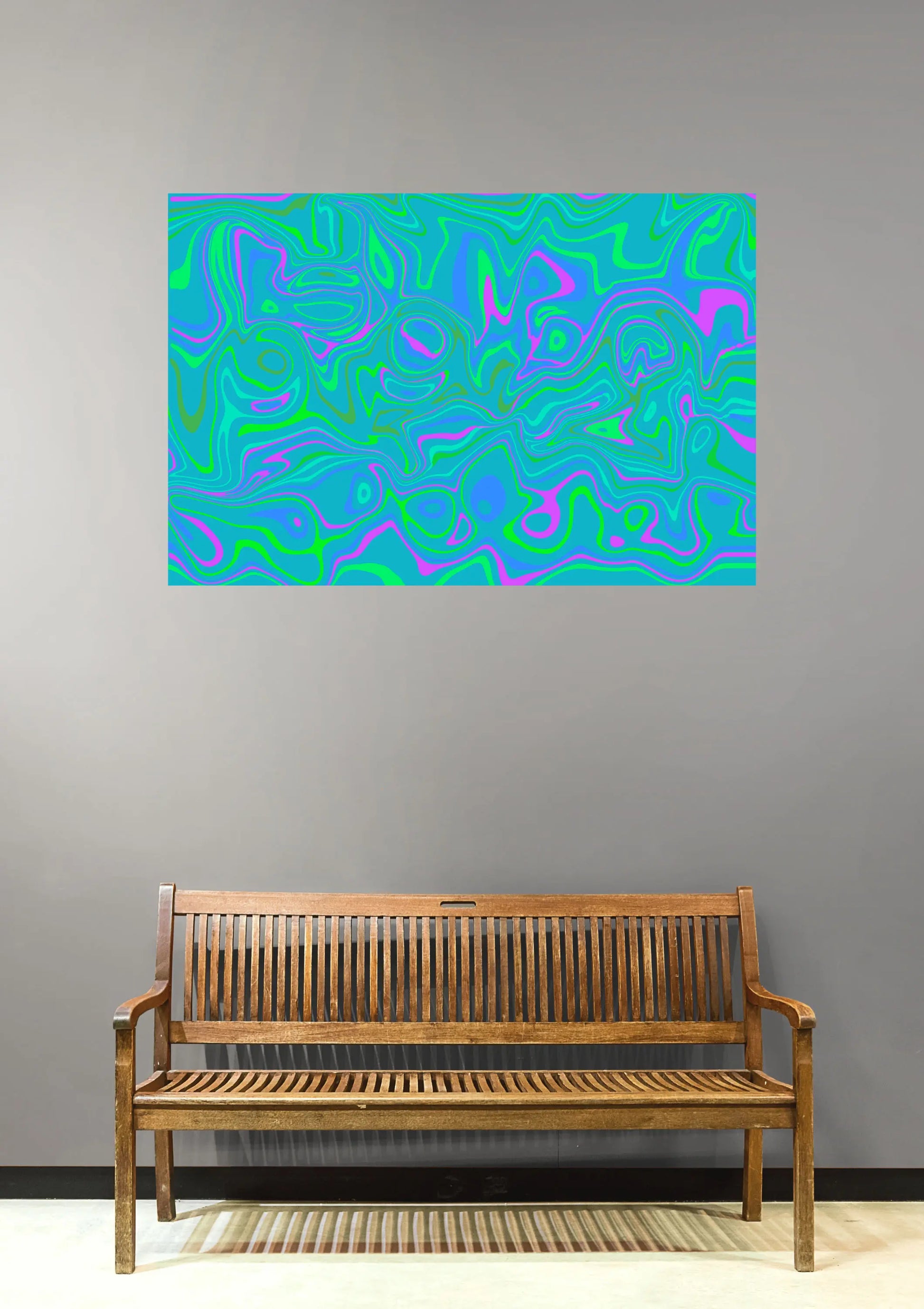 Abstract colorful painting on a gray wall above a wooden bench.