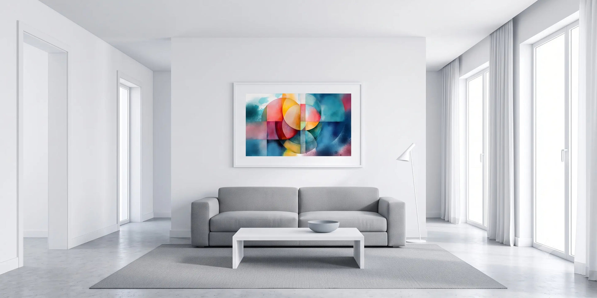 A modern living room with a gray sofa and white coffee table, featuring a colorful abstract framed wall art print hanging above the couch.