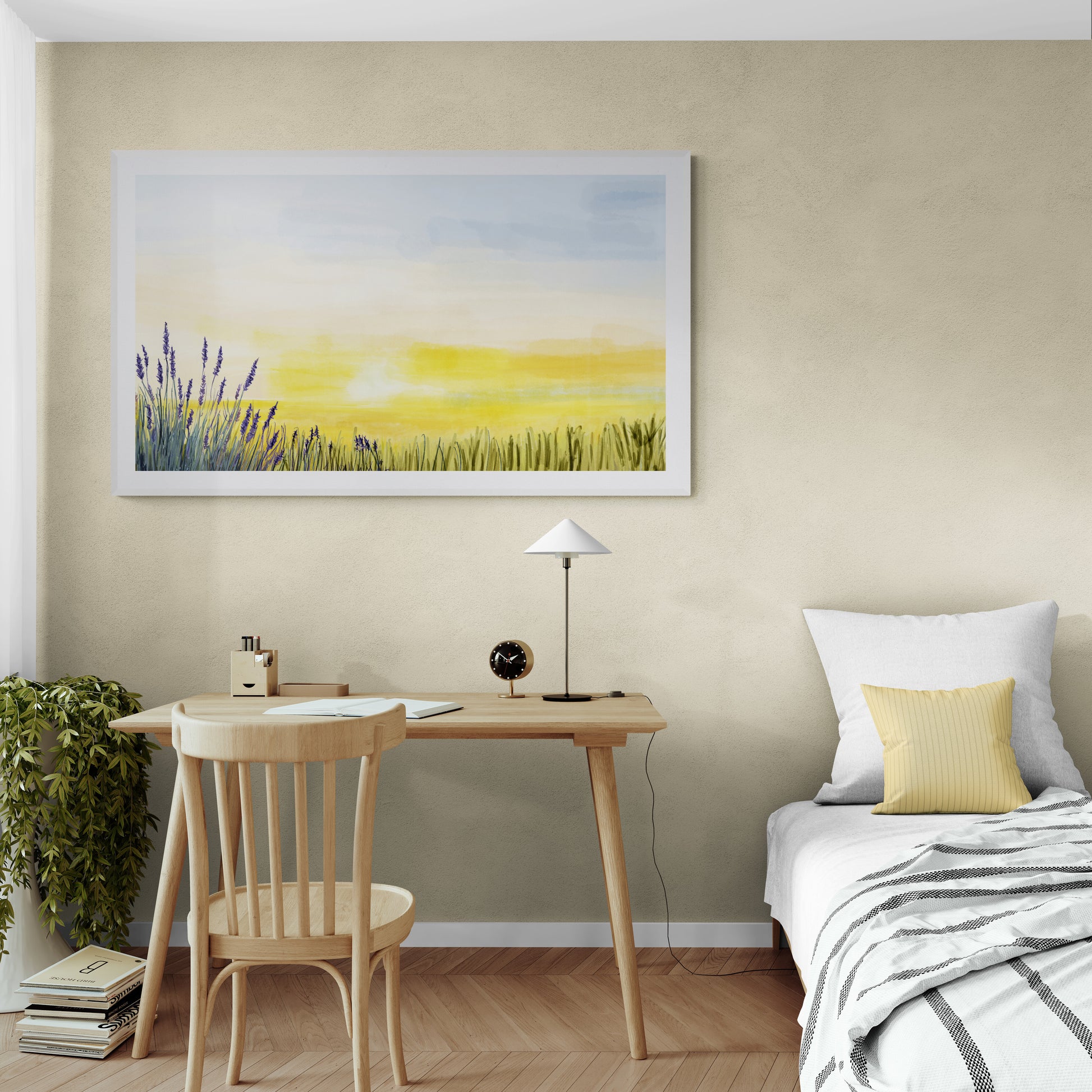 Modern bedroom with a desk, chair, and painting of a sunset over a field.