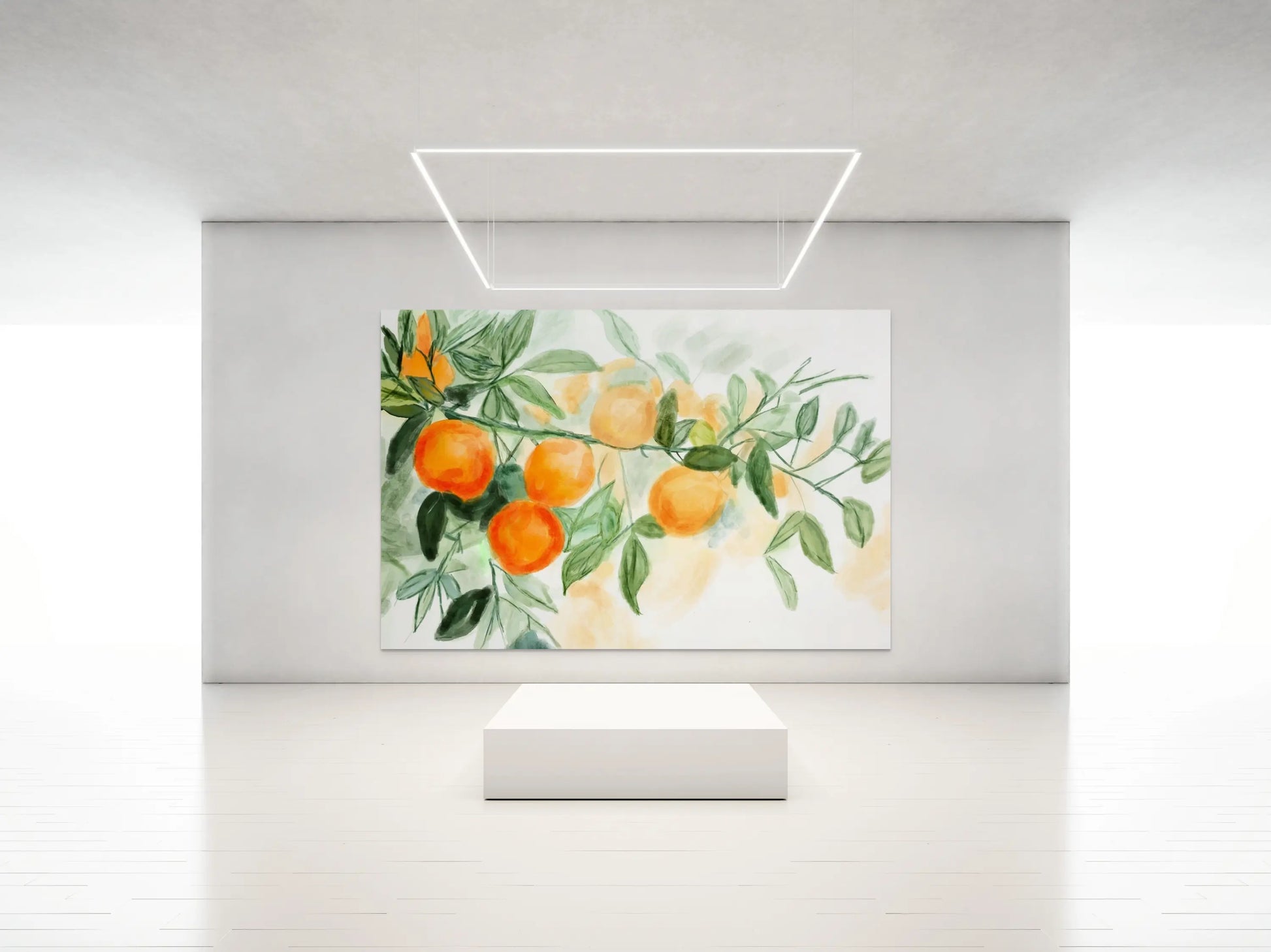 Framed artwork of oranges on a branch with leaves on a white wall.