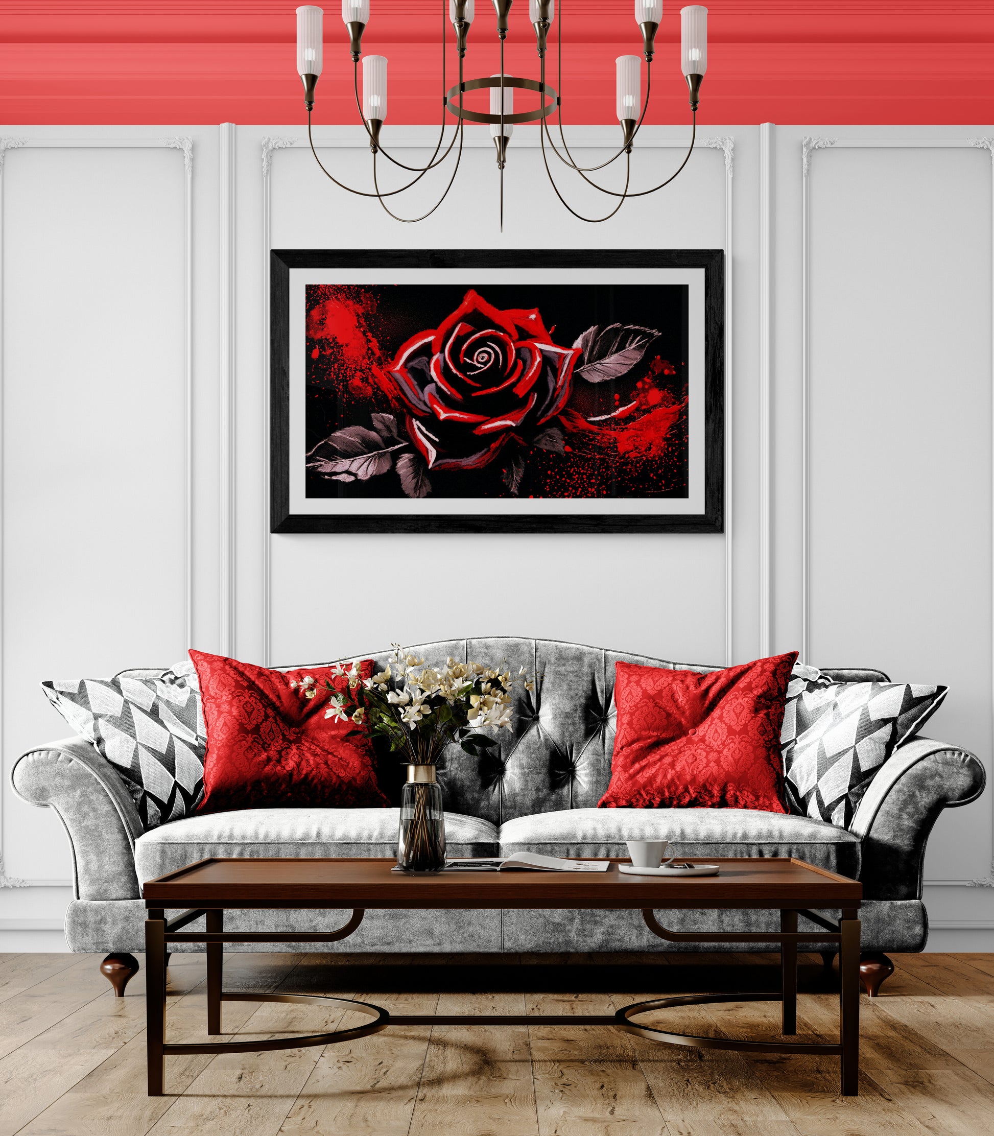 Living room with a gray sofa, red pillows, a coffee table, and a framed red rose painting on the wall.