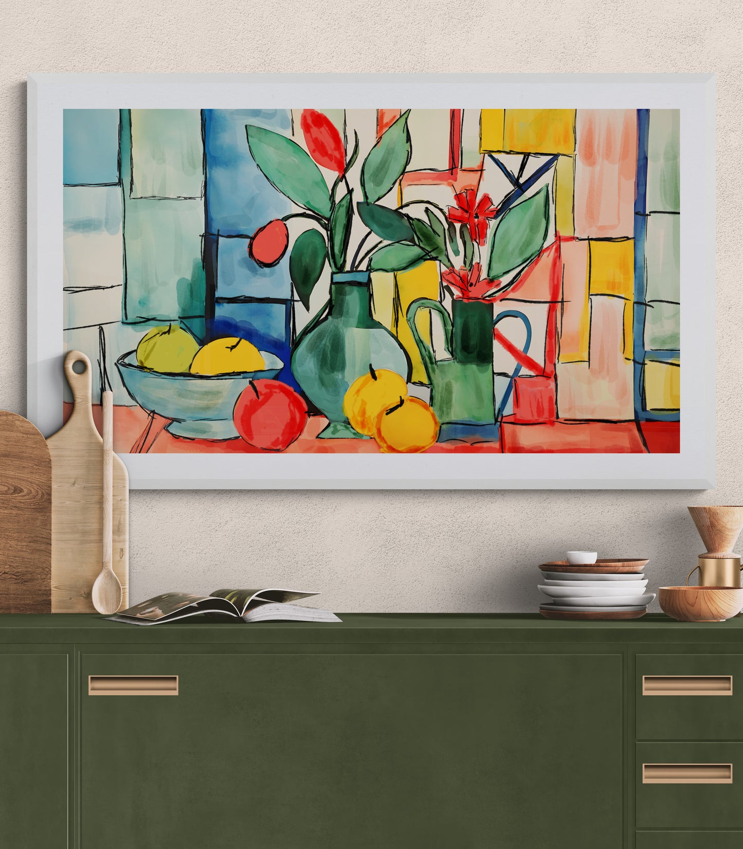 Framed still life painting with fruits and flowers on a wall above a green cabinet.