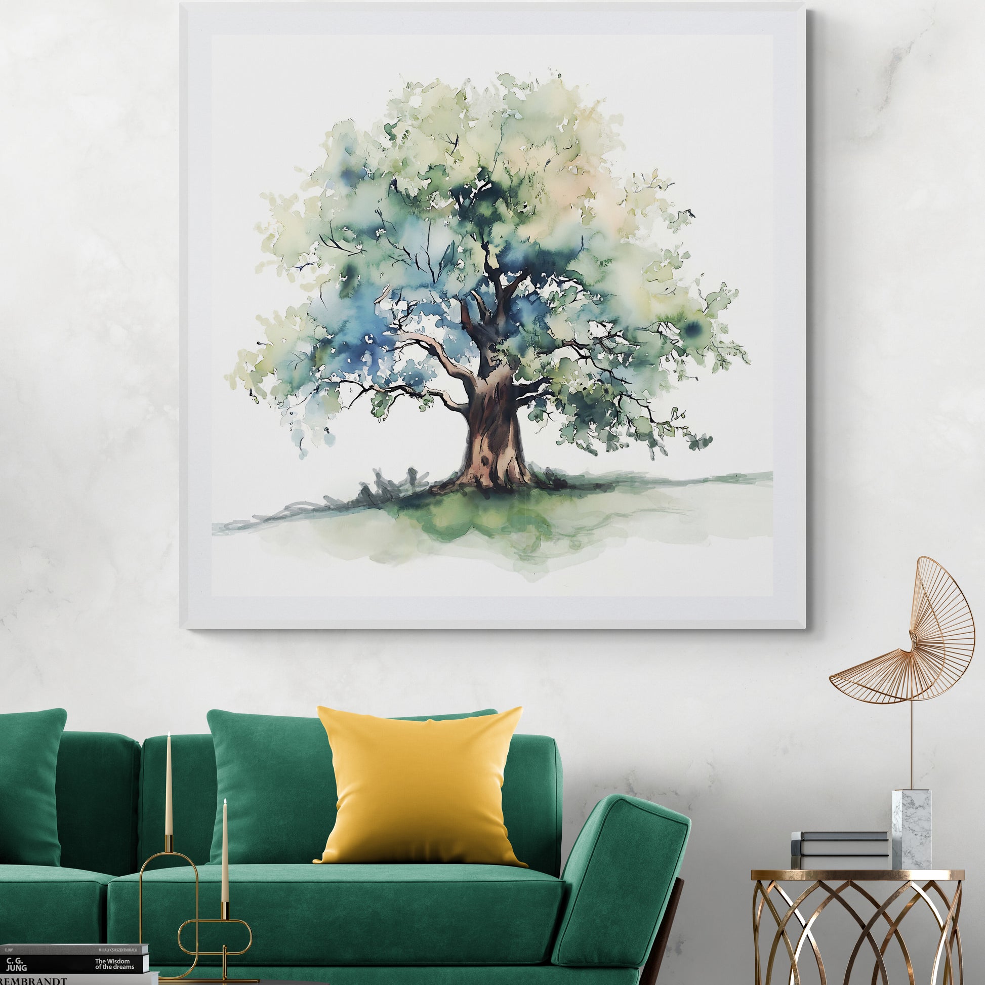 Framed artwork of a tree on a wall above a green sofa with yellow pillow.