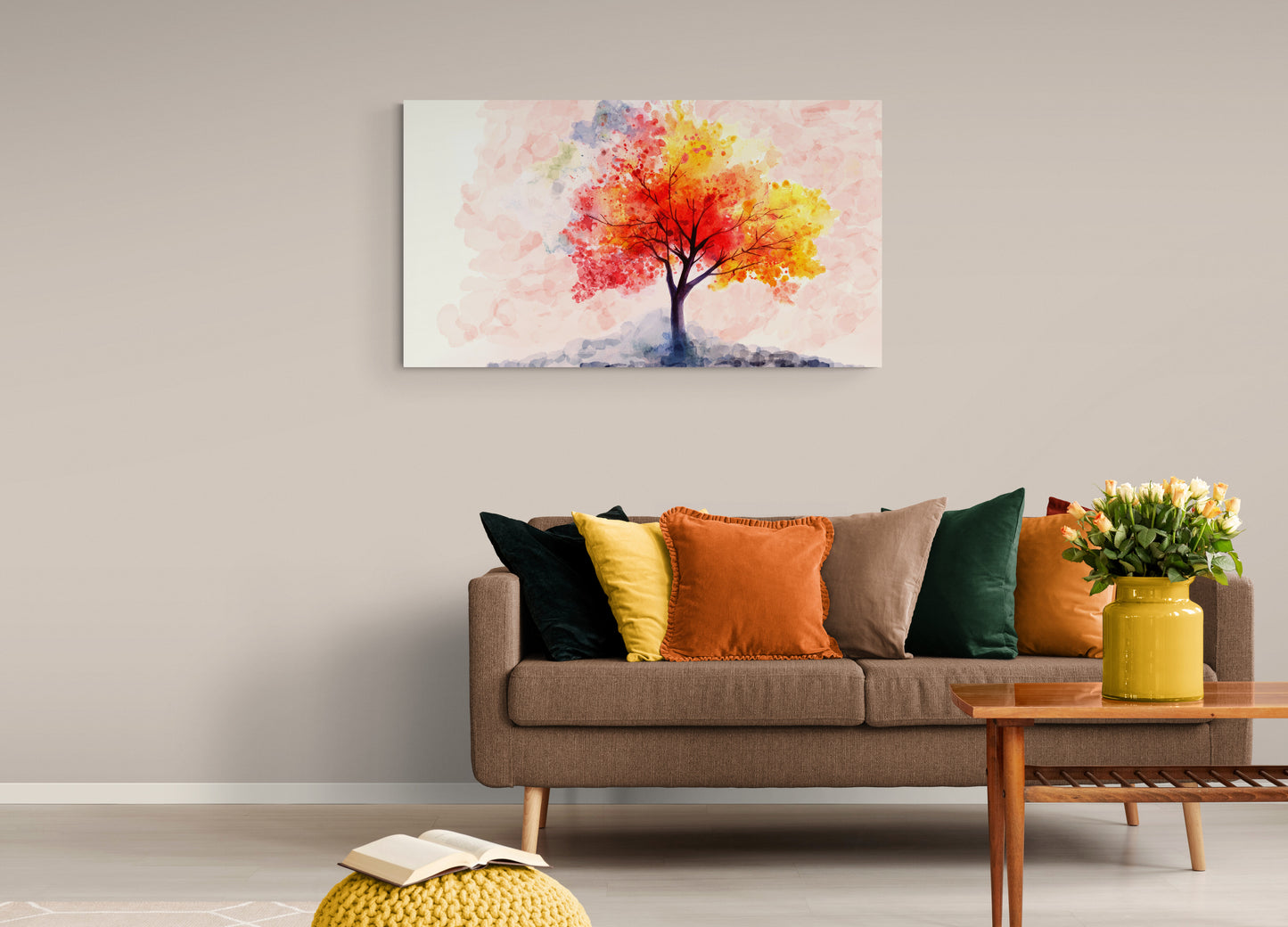 Living room with a colorful tree painting on the wall, brown sofa with multicolored cushions, and a wooden coffee table with a vase of flowers.