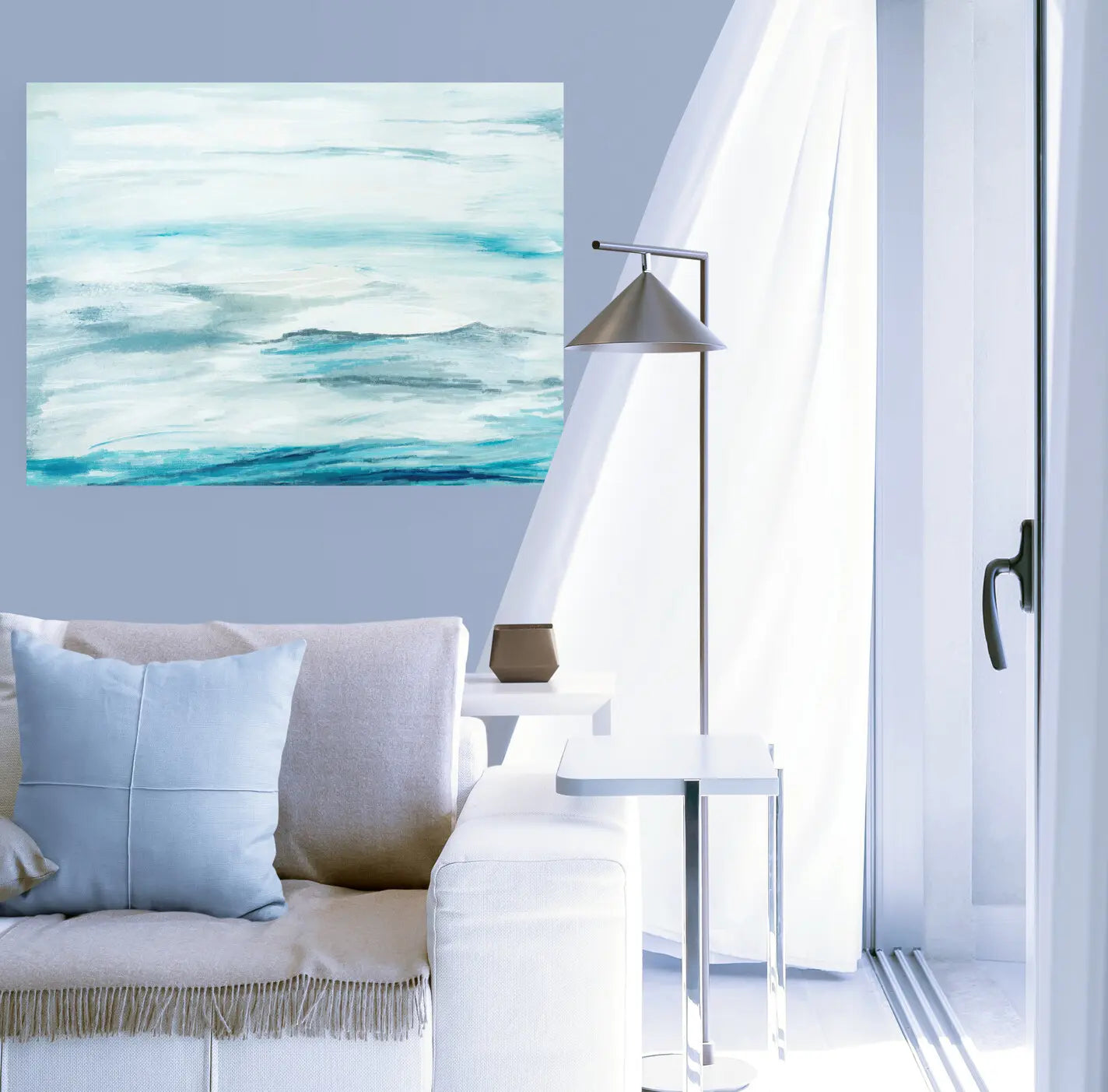 Modern living room with a couch, lamp, and abstract painting on a light blue wall.