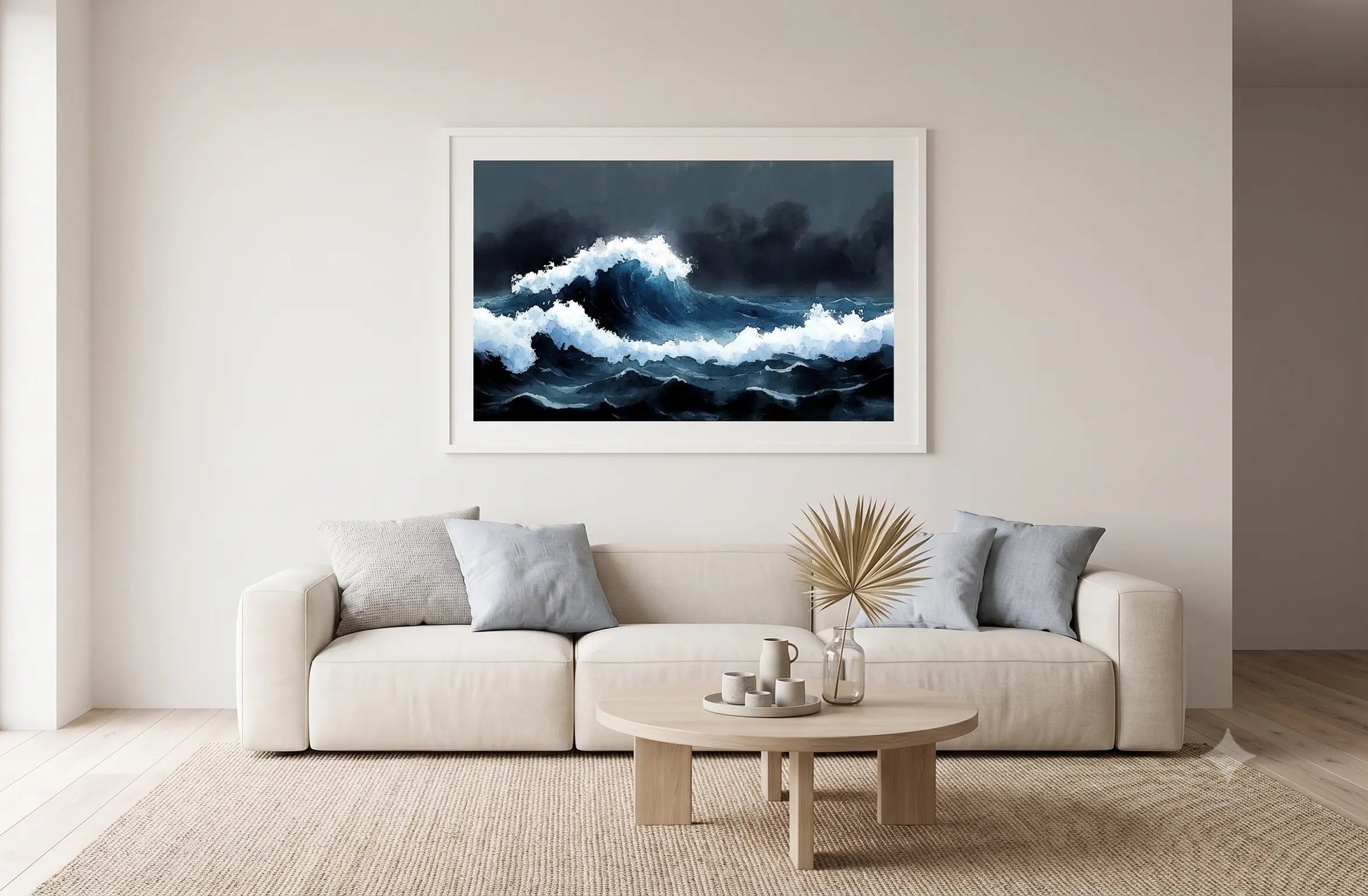 A framed square art print depicting a dramatic dark blue and white ocean wave, displayed on a beige wall above a modern white sofa in a minimalist living room.